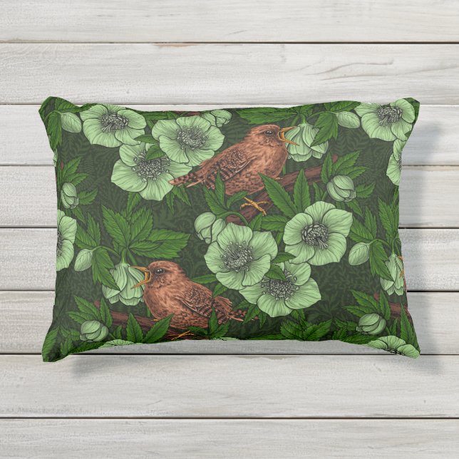 Wren and hellebore on dark green outdoor pillow (Front)