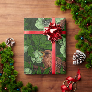 Wren and hellebore on dark green wrapping paper