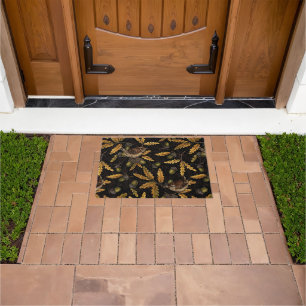 Wrens and acorns on black doormat
