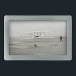 Wright Brothers Flyer First Plane Flight Aviation Belt Buckle<br><div class="desc">The Wright Flyer was a 1903 invention by Brothers Orville Wright and Wilbur Wright. The first motorized plane flight of a Airplane happened on December 17, 1903 near Kitty Hawk, North Carolina. This work is in the public domain in the United States because it was published (or registered with the...</div>