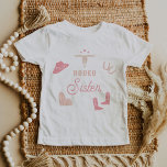 WYNONA Blush Pink Cowgirl Rodeo Sister T-Shirt<br><div class="desc">This toddler t shirt features cute blush pink cowgirl graphics and the words 'rodeo sister' in a sweet rodeo font combination. This sister shirt is the perfect gift for your favorite sis as a pregnancy announcement or works great with the first rodeo themed birthday Wynona Collection.</div>