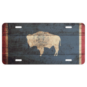 Wyoming State Flag on Old Wood Grain License Plate