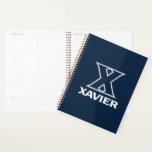 Xavier University Planner<br><div class="desc">Get ready to level up your everyday swagger and show the world your undeniable school pride with this official Xavier University product! Whether you are a dedicated student crushing your classes on the vibrant campus, a proud alumni representing your fierce collegiate roots, or a passionate fan cheering loudly for the...</div>