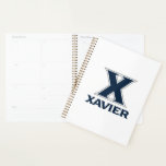Xavier University Planner<br><div class="desc">Get ready to level up your everyday swagger and show the world your undeniable school pride with this official Xavier University product! Whether you are a dedicated student crushing your classes on the vibrant campus, a proud alumni representing your fierce collegiate roots, or a passionate fan cheering loudly for the...</div>