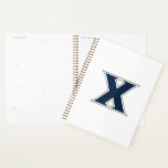 Xavier University Planner<br><div class="desc">Get ready to level up your everyday swagger and show the world your undeniable school pride with this official Xavier University product! Whether you are a dedicated student crushing your classes on the vibrant campus, a proud alumni representing your fierce collegiate roots, or a passionate fan cheering loudly for the...</div>