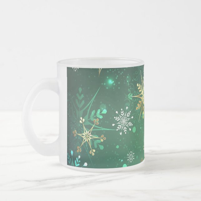 Xmas Golden Snowflakes on Green Background Frosted Glass Coffee Mug (Left)