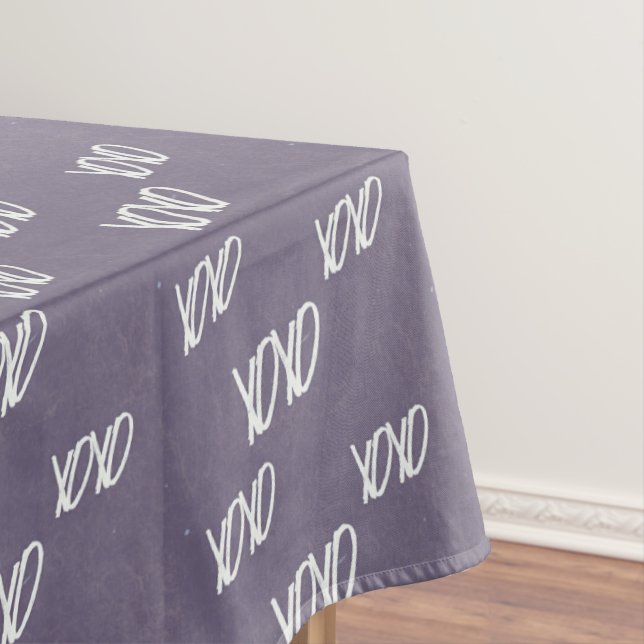 Xoxo handwriting on gray tablecloth (In Situ)