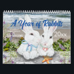 Year of Rabbit Bunny Cute Nature Woodland Art Calendar<br><div class="desc">This whimsical calendar celebrates rabbits with 12 colorful artistic scenes of cute bunny rabbit couples enjoying each month's festivities. Perfect for the Year of the Rabbit, 2023! Snuggle bunny companions in winter snow, in flower gardens, in woodland settings, enjoying time at the sea coast, in a pumpkin patch, and in...</div>