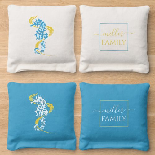 Yellow and aqua blue seahorse and family name cornhole bags
