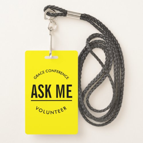 Yellow and black ask me volunteer badge
