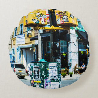 YELLOW AND BLACK POST FILLED WITH FLYERS ROUND PILLOW