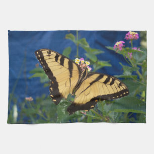 Yellow and black swallowtail butterfly on a kitchen towel