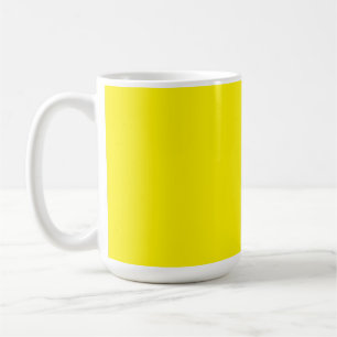 Yellow and orange abstract shapes overlap on a pla coffee mug