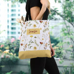 Yellow and Orange Wildflowers Tote Bag<br><div class="desc">Bring a pop of color and a touch of summer to your daily routine with this pretty wildflower tote bag. Featuring an all over watercolor yellow and orange wildflower print, this tote is the perfect accessory for any season. Great for carrying your everyday essentials, such as books, laptop, or shopping...</div>
