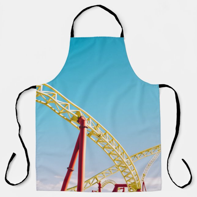 Yellow and red roller coaster under blue sky at da apron (Front)