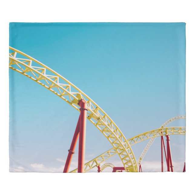 Yellow and red roller coaster under blue sky at da duvet cover (Front)