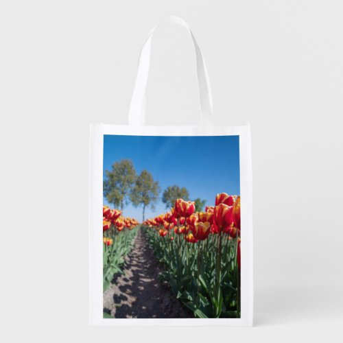 Yellow and Red Tulips on a field Grocery Bag
