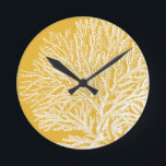 Yellow and White Coral Round Clock<br><div class="desc">Get this modern piece of artwork today with a vibrant yellow background. This piece of art contains a silhouette,  translucent coral that is very sharp and vivid. It's a contemporary art piece that will be perfect for any type of nautical theme you are trying to go for.</div>