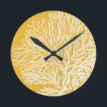 Yellow and White Coral Round Clock<br><div class="desc">Get this modern piece of artwork today with a vibrant yellow background. This piece of art contains a silhouette,  translucent coral that is very sharp and vivid. It's a contemporary art piece that will be perfect for any type of nautical theme you are trying to go for.</div>