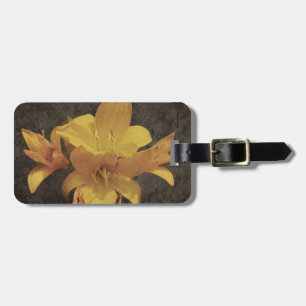Yellow Asiatic lily on old grunged canvas backgrou Luggage Tag
