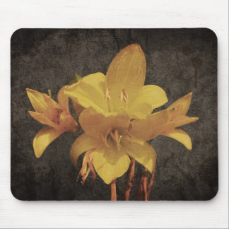 Yellow Asiatic lily on old grunged canvas backgrou Mouse Pad