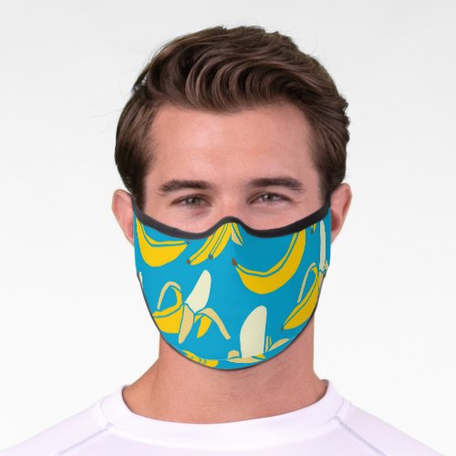 Yellow bananas blue background pattern premium face mask