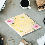 Yellow bees Cute pink tropical florals Notepad<br><div class="desc">Add some fun and humor to your summer grocery shopping lists or home office! Yellow,  white background with a bee honeycomb pattern. Decorated with pink tropical flowers,  florals,  hibiscus and happy smiling bumble bees. Your name written with a golden hand lettered style script.</div>
