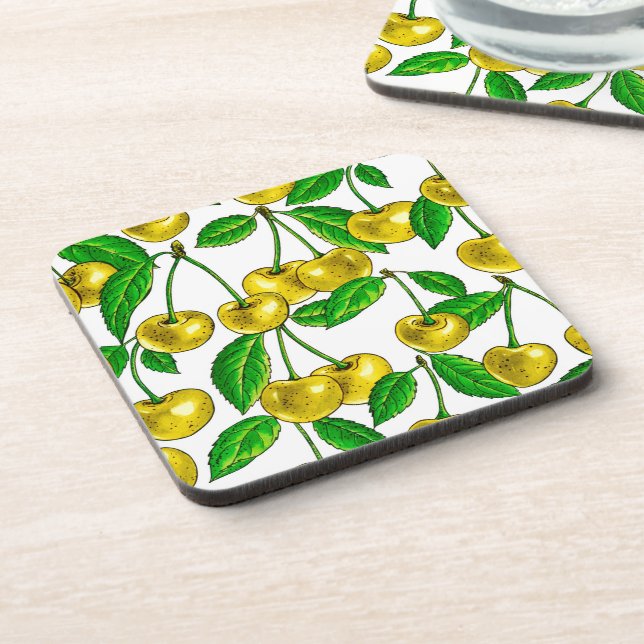 Yellow cherries on white beverage coaster (Left Side)