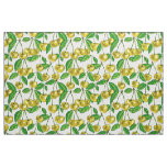 Yellow cherries on white fabric