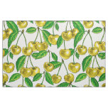 Yellow cherries on white fabric