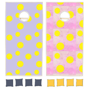 Yellow circles on purple pattern cornhole set