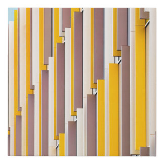 YELLOW CONCRETE BUILDING DURING DAYTIME FAUX CANVAS PRINT