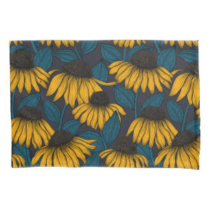 Yellow coneflowers on dark blue pillow case