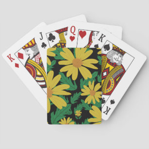 Yellow daisy flowers with green leaves playing ca poker cards