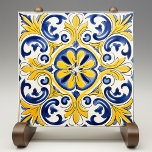 Yellow Fleur-de-Lis Azulejo Print Ceramic Tile<br><div class="desc">Add a splash of Mediterranean sunshine to your home with our Golden Fleur-de-Lis Azulejo Tile Print. This exquisite piece captures the vibrant beauty and intricate designs of the iconic Portuguese azulejos. The bold golden yellow and rich royal blue hues are accented by delicate touches of white and orange, creating a...</div>