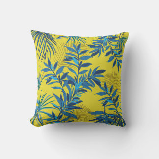 Yellow floral pillow with vibrant blue and green 