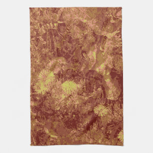 Yellow flower against leaf camouflage pattern towel