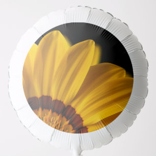 Yellow flower on black background balloon