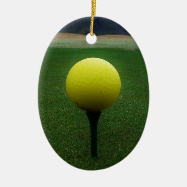 Yellow Golf Ball on a mountain golf course Ceramic Ornament (Front)