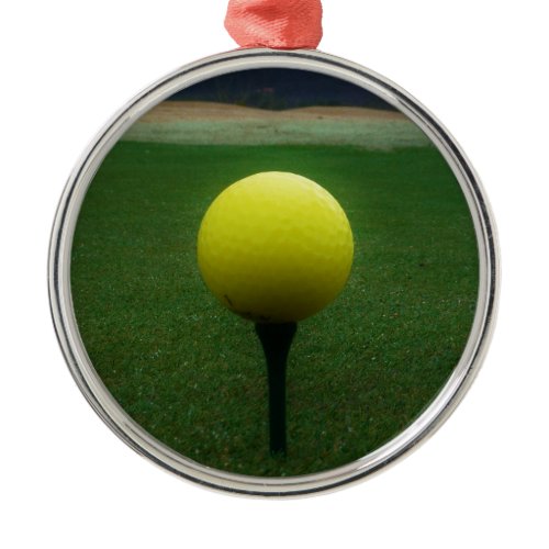 Yellow Golf Ball on a mountain golf course Metal Ornament