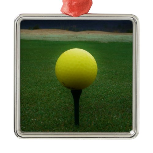 Yellow Golf Ball on a mountain golf course Metal Ornament