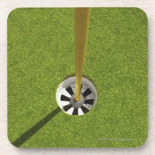 Yellow golf flag pole and hole beverage coaster