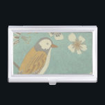 Yellow, Grey and Beige Bird Perched on a Branch Business Card Case<br><div class="desc">Chariklia Zarris is known for her abstract art pieces. In this drawing of a profile of a bird on a blue teal background,  she captured the simplicity of the bird. The white flowers add a romantic touch. Customize your favorite Zazzle product using this beautiful image.</div>