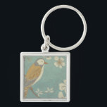 Yellow, Grey and Beige Bird Perched on a Branch Keychain<br><div class="desc">Chariklia Zarris is known for her abstract art pieces. In this drawing of a profile of a bird on a blue teal background,  she captured the simplicity of the bird. The white flowers add a romantic touch. Customize your favorite Zazzle product using this beautiful image.</div>