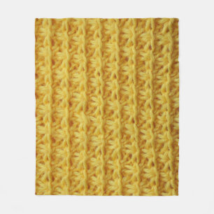 Yellow knitted fabric: striped texture. fleece blanket