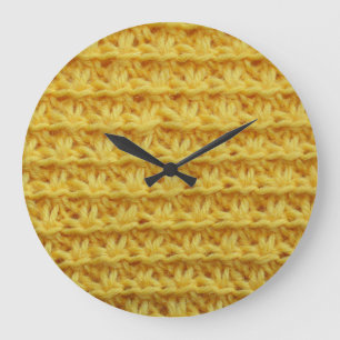 Yellow knitted fabric: striped texture. large clock