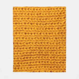 Yellow knitted wool texture background pattern wit fleece blanket