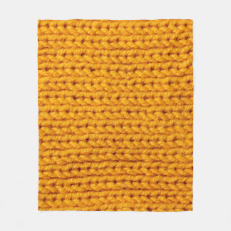 Yellow knitted wool texture background pattern wit fleece blanket