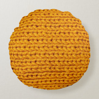 Yellow knitted wool texture background pattern wit round pillow