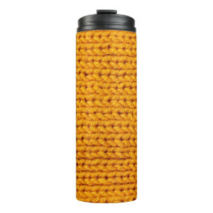 Yellow knitted wool texture background pattern wit thermal tumbler
